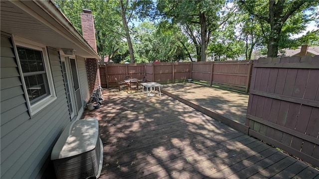2006 Colonial Dr, Pittsburg, KS 66762 - wooden terrace with a fenced backyard and outdoor dining space