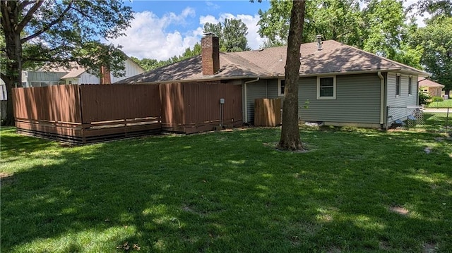 2006 Colonial Dr, Pittsburg, KS 66762 - rear view of house with a chimney and roof with shingles