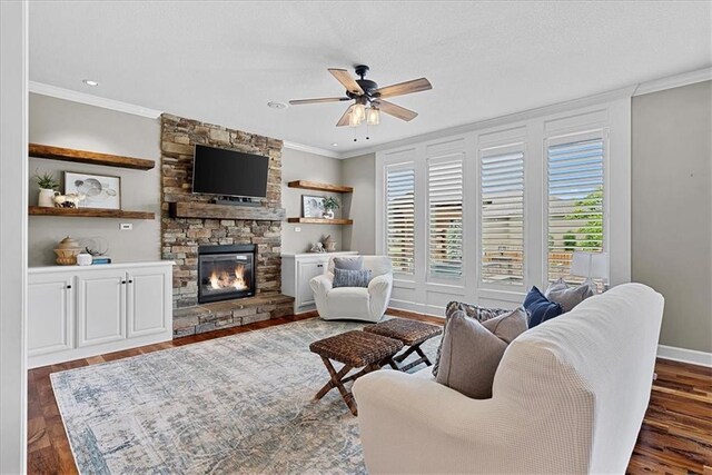 17746 W 165th Pl, Olathe, KS 66062 - living area featuring crown molding, ceiling fan, a stone fireplace, and wood finished floors
