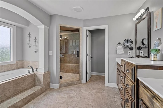 17746 W 165th Pl, Olathe, KS 66062 - full bathroom with a bath, vanity, a stall shower, and ornate columns