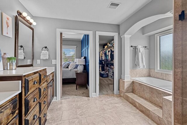 17746 W 165th Pl, Olathe, KS 66062 - ensuite bathroom featuring a garden tub, a walk in closet, and vanity