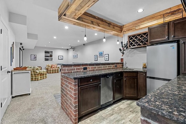 17746 W 165th Pl, Olathe, KS 66062 - kitchen featuring stainless steel appliances, a peninsula, dark brown cabinets, and recessed lighting