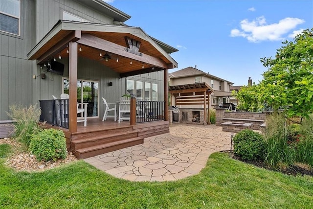 17746 W 165th Pl, Olathe, KS 66062 - back of property featuring exterior kitchen, a patio, a deck, and a fire pit
