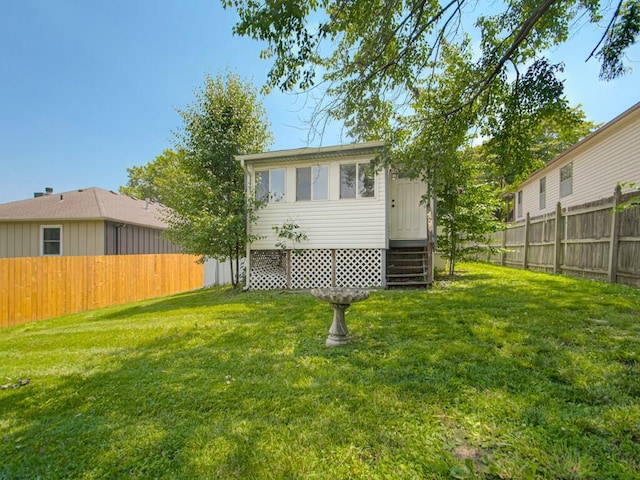17928 E Whitney Rd, Independence, MO 64057 - back of house featuring a fenced backyard and entry steps