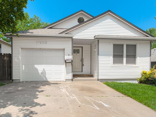 17928 E Whitney Rd, Independence, MO 64057 - view of front of house with an attached garage and concrete driveway
