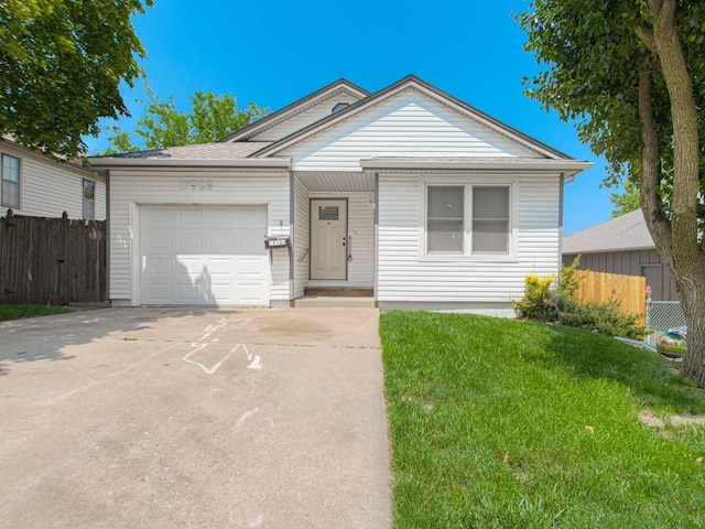17928 E Whitney Rd, Independence, MO 64057 - view of front of home featuring an attached garage and concrete driveway