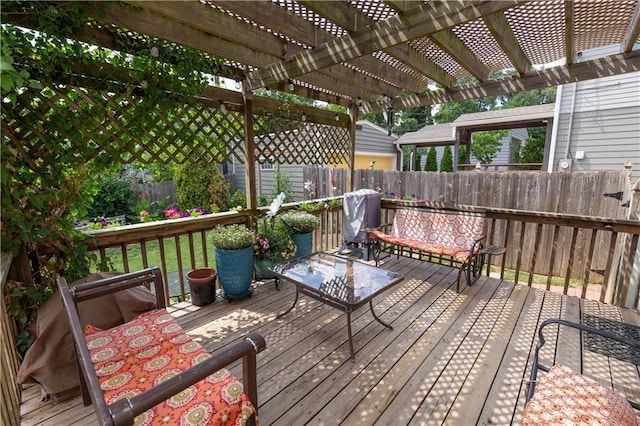 4930 Holly St, Kansas City, MO 64112 - wooden deck with a fenced backyard, a pergola, and a grill