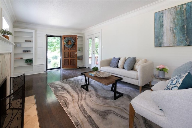 4930 Holly St, Kansas City, MO 64112 - living area with crown molding, wood finished floors, built in features, and a fireplace with flush hearth