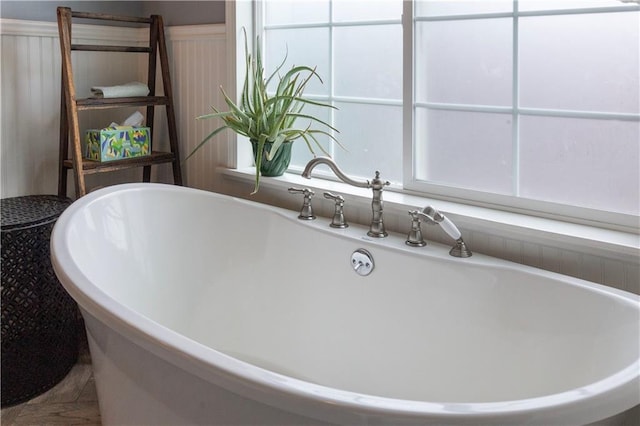 4930 Holly St, Kansas City, MO 64112 - bathroom featuring a freestanding tub