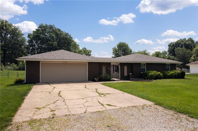 2207 N 154th Ter, Basehor, KS 66007 - ranch-style home with driveway, a garage, a front lawn, and brick siding
