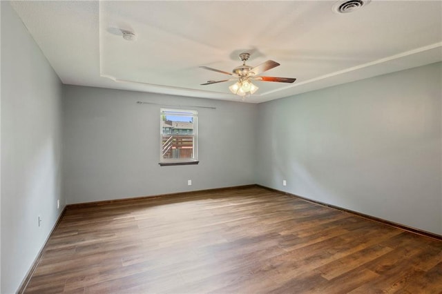 2207 N 154th Ter, Basehor, KS 66007 - empty room featuring a ceiling fan, wood finished floors, and a smoke detector