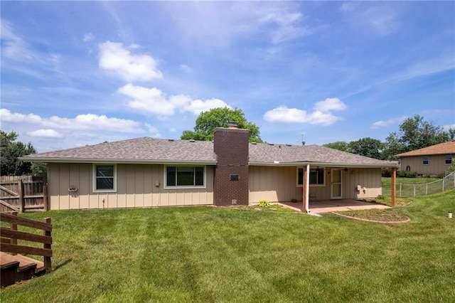 2207 N 154th Ter, Basehor, KS 66007 - rear view of house with a patio area and a chimney