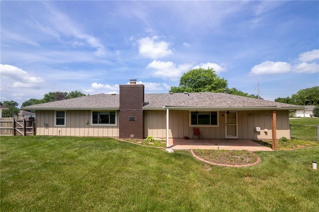 2207 N 154th Ter, Basehor, KS 66007 - rear view of property featuring board and batten siding, a patio, a chimney, and roof with shingles