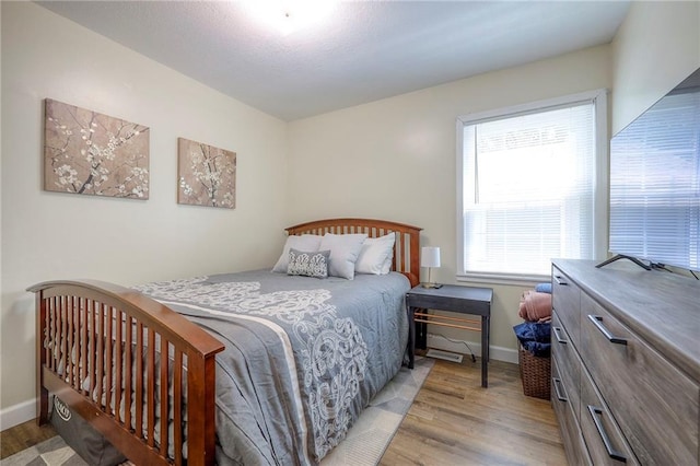 5603 Cody St, Shawnee, KS 66203 - bedroom featuring light wood-type flooring and baseboards