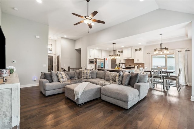 1402 NW Red Oak Ct, Grain Valley, MO 64029 - living area featuring dark wood-style floors, a ceiling fan, a chandelier, and recessed lighting