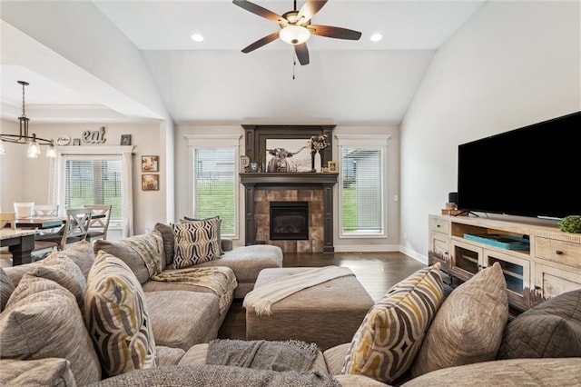 1402 NW Red Oak Ct, Grain Valley, MO 64029 - living room with lofted ceiling, plenty of natural light, wood finished floors, ceiling fan, and a fireplace