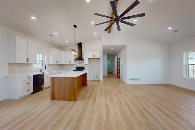 350 NW 1201st Rd, Holden, MO 64040 - kitchen featuring black dishwasher, wall chimney exhaust hood, stove, a center island, and open floor plan
