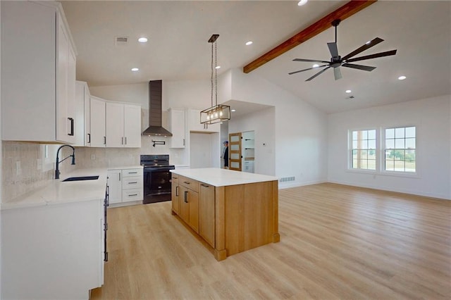 350 NW 1201st Rd, Holden, MO 64040 - kitchen featuring black / electric stove, wall chimney range hood, light wood finished floors, beam ceiling, and backsplash