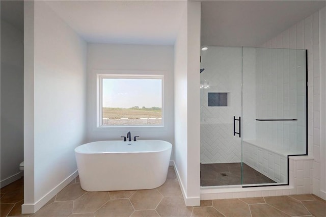 350 NW 1201st Rd, Holden, MO 64040 - bathroom featuring a stall shower, a soaking tub, and tile patterned flooring
