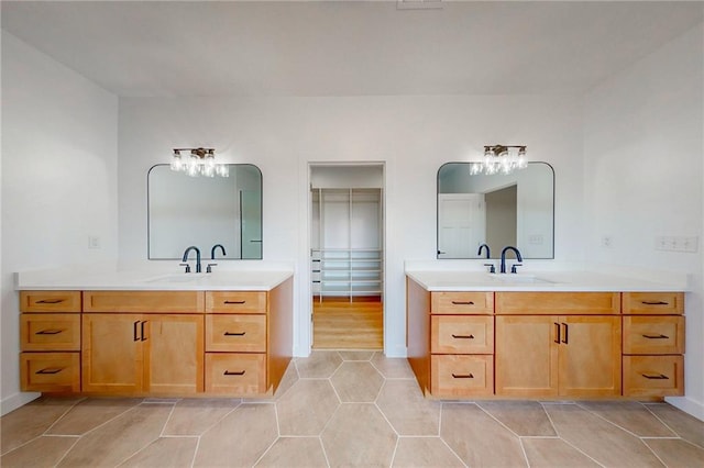 350 NW 1201st Rd, Holden, MO 64040 - full bath with two vanities, tile patterned flooring, and a chandelier