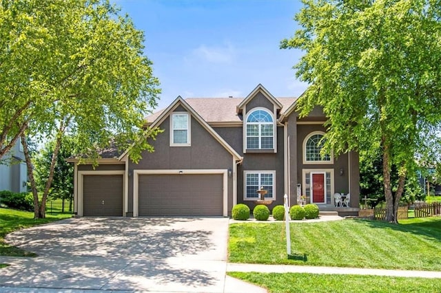600 SW Gentry Ln, Lees Summit, MO 64081 - view of front facade with concrete driveway, stucco siding, and a garage