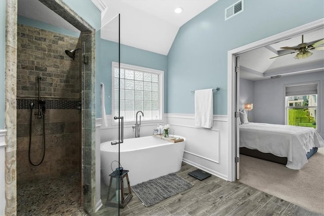 600 SW Gentry Ln, Lees Summit, MO 64081 - bathroom featuring tiled shower, a freestanding tub, ensuite bathroom, healthy amount of natural light, and wainscoting