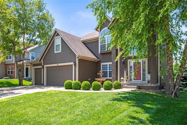 600 SW Gentry Ln, Lees Summit, MO 64081 - view of front facade with stucco siding, driveway, a front yard, and an attached garage
