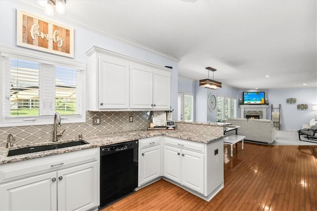600 SW Gentry Ln, Lees Summit, MO 64081 - kitchen with dishwasher, a peninsula, white cabinetry, light wood-style floors, and ornamental molding