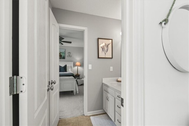 600 SW Gentry Ln, Lees Summit, MO 64081 - bathroom featuring connected bathroom, vanity, a ceiling fan, and tile patterned floors