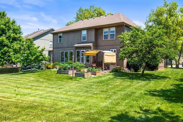600 SW Gentry Ln, Lees Summit, MO 64081 - rear view of house featuring a garden