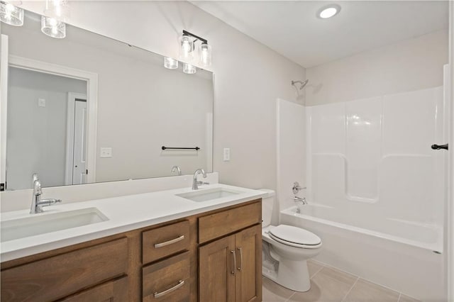 1913 SW Hightown Dr, Lees Summit, MO 64082 - full bathroom with double vanity, toilet, tile patterned floors, and shower / washtub combination