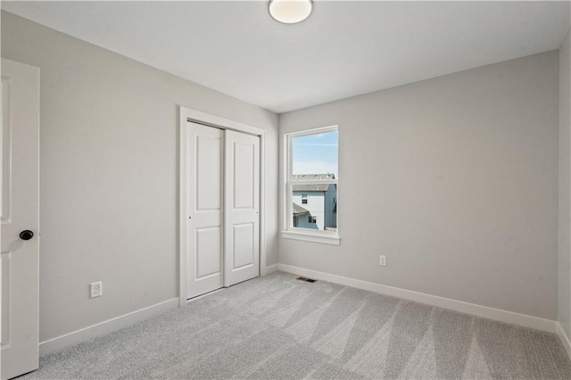 1913 SW Hightown Dr, Lees Summit, MO 64082 - unfurnished bedroom featuring carpet, a closet, and baseboards