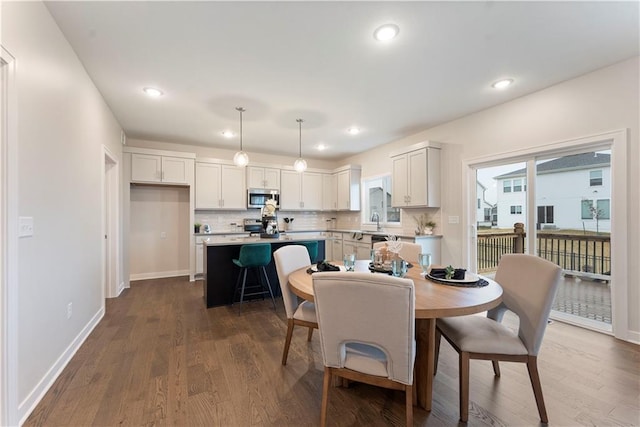 1913 SW Hightown Dr, Lees Summit, MO 64082 - dining space with dark wood-style floors, baseboards, and recessed lighting