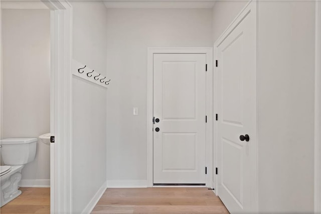 1913 SW Hightown Dr, Lees Summit, MO 64082 - doorway with light wood-style flooring and baseboards
