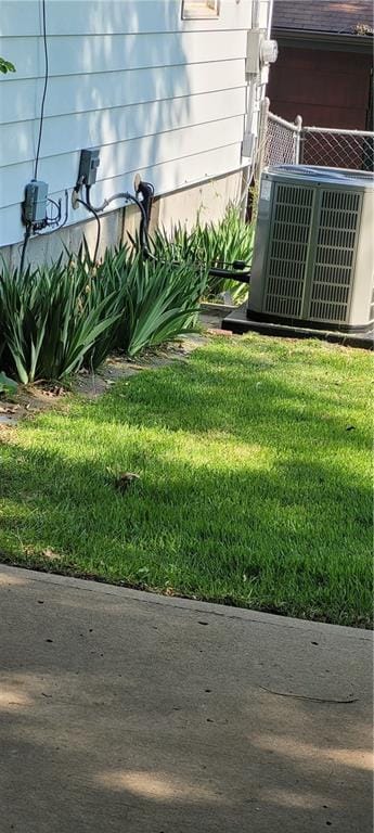 2838 N 64th Ter, Kansas City, KS 66104 - view of grassy yard featuring central AC unit
