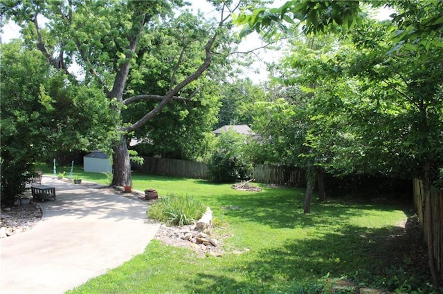 421 N Nettleton Ave, Bonner Springs, KS 66012 - fenced backyard featuring a shed