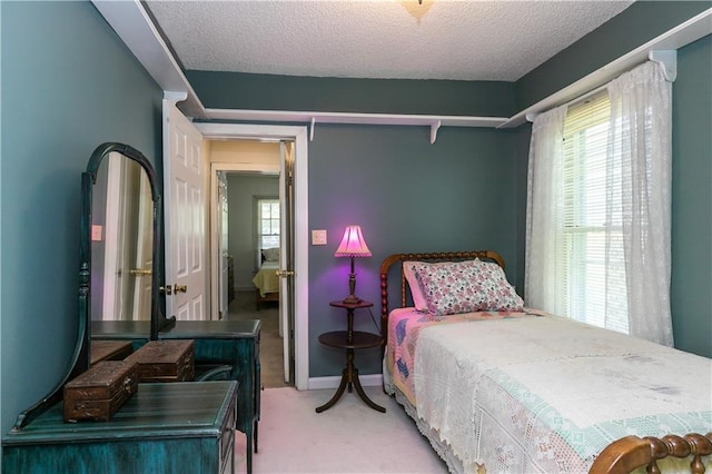 421 N Nettleton Ave, Bonner Springs, KS 66012 - bedroom with light carpet and a textured ceiling