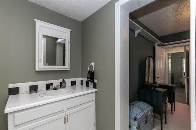 421 N Nettleton Ave, Bonner Springs, KS 66012 - bathroom featuring a textured ceiling and vanity