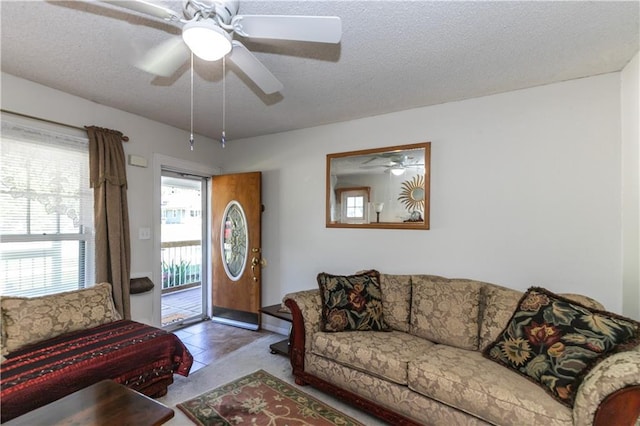 421 N Nettleton Ave, Bonner Springs, KS 66012 - tiled living room with a ceiling fan and a textured ceiling