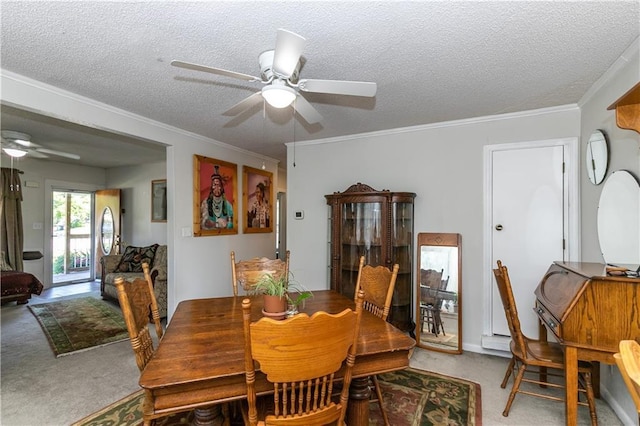 421 N Nettleton Ave, Bonner Springs, KS 66012 - carpeted dining area featuring a ceiling fan, a textured ceiling, and ornamental molding