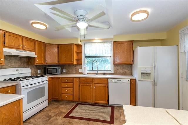 421 N Nettleton Ave, Bonner Springs, KS 66012 - kitchen with white appliances, under cabinet range hood, brown cabinets, light countertops, and open shelves