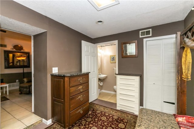 421 N Nettleton Ave, Bonner Springs, KS 66012 - tiled bedroom featuring connected bathroom and a closet