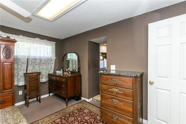 421 N Nettleton Ave, Bonner Springs, KS 66012 - carpeted bedroom with a textured ceiling and baseboards