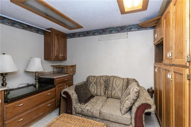 421 N Nettleton Ave, Bonner Springs, KS 66012 - living area with a textured ceiling and light tile patterned floors