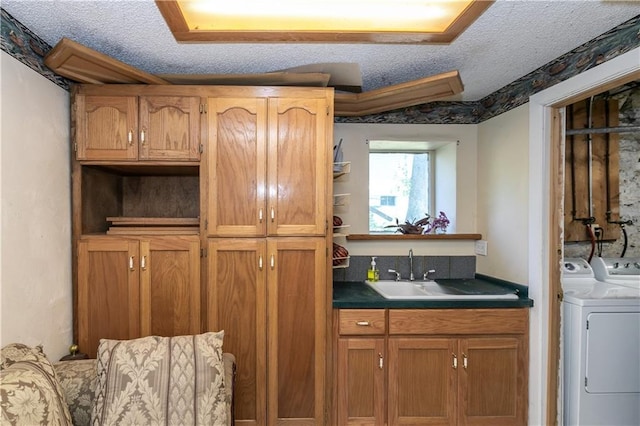 421 N Nettleton Ave, Bonner Springs, KS 66012 - kitchen featuring a textured ceiling, dark countertops, and brown cabinets