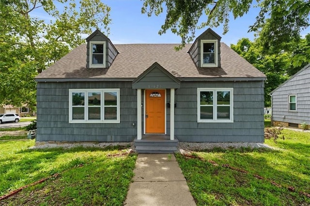 13623 W 95th St, Lenexa, KS 66215 - view of front of house with a front lawn and roof with shingles