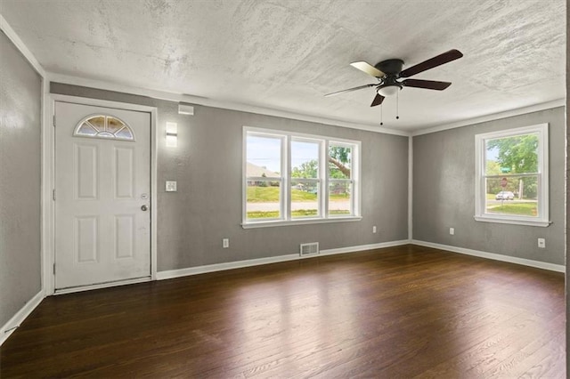 13623 W 95th St, Lenexa, KS 66215 - foyer entrance featuring dark wood-style flooring, a ceiling fan, a textured ceiling, and a textured wall