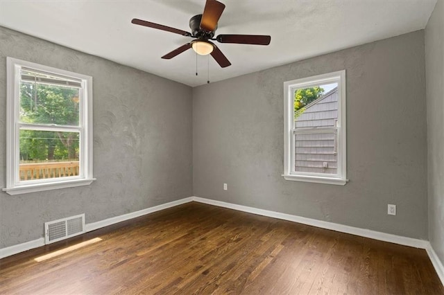 13623 W 95th St, Lenexa, KS 66215 - spare room featuring hardwood / wood-style flooring and ceiling fan