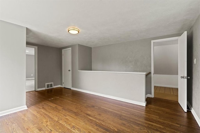 13623 W 95th St, Lenexa, KS 66215 - spare room with wood finished floors and a textured ceiling