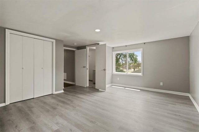 13623 W 95th St, Lenexa, KS 66215 - unfurnished bedroom with wood finished floors, a closet, and recessed lighting